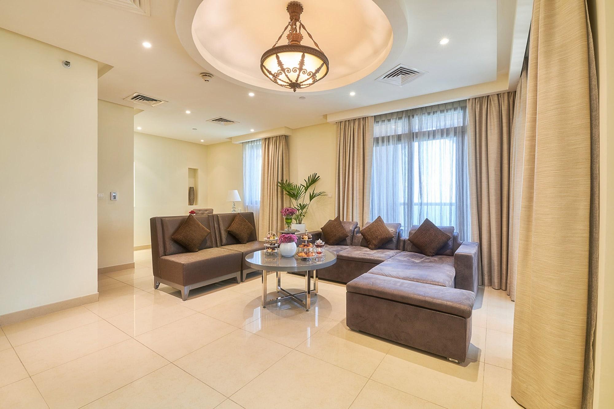 Bahi Ajman Palace Hotel Exterior photo A living room in a suite at the hotel